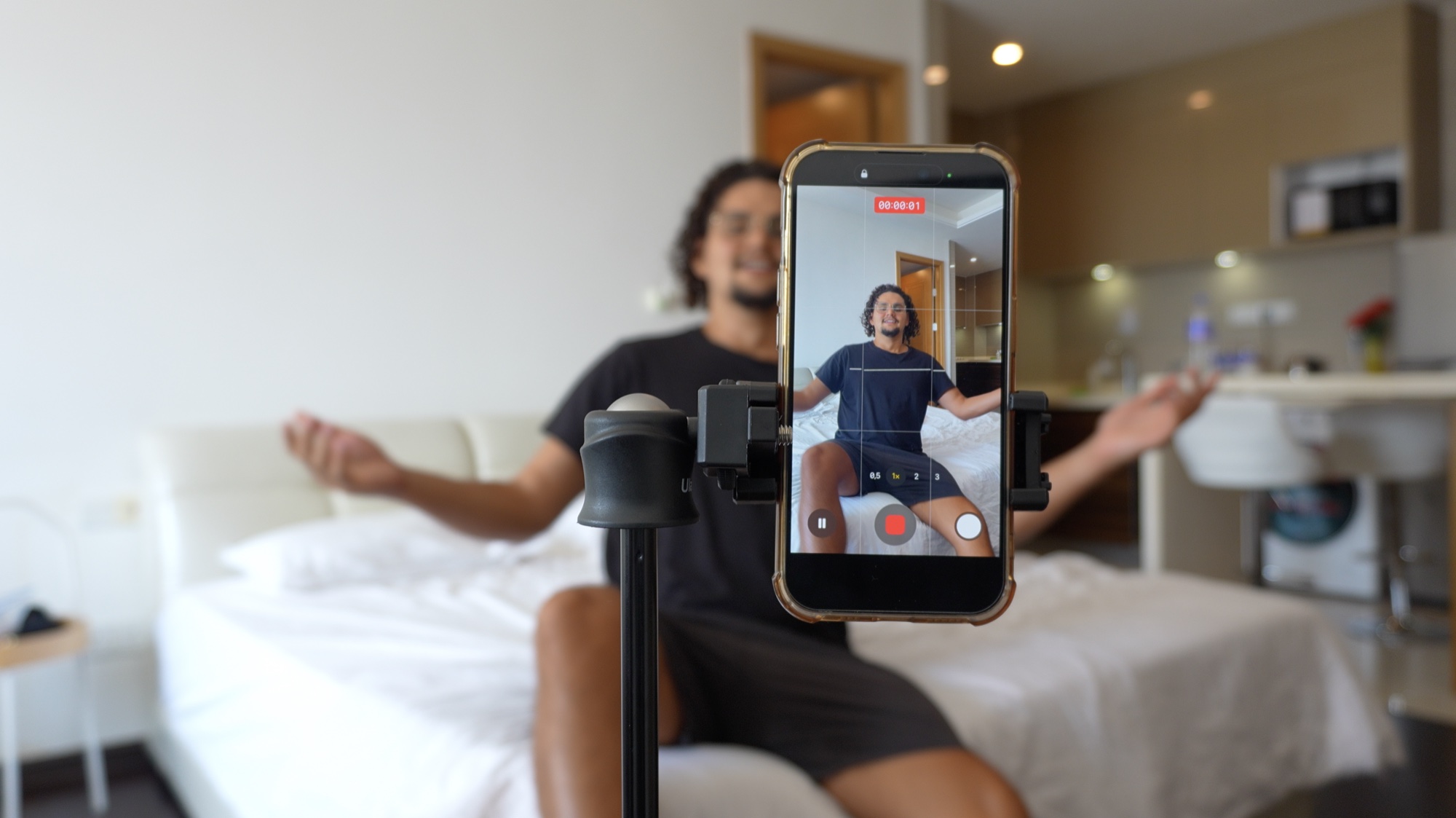 Res recording a Moray Studio video with a phone on a tripod